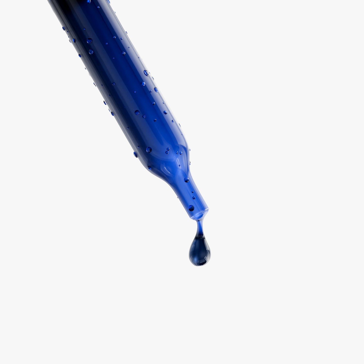 Dropper dispensing blue liquid from Methylene Blue Drops supplement