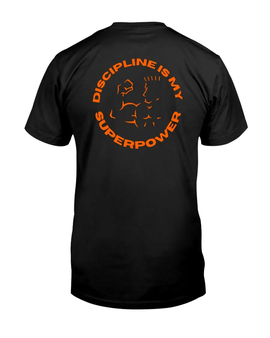 Back of black tee with orange circular graphic