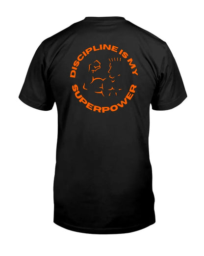 Back of black tee with orange circular graphic