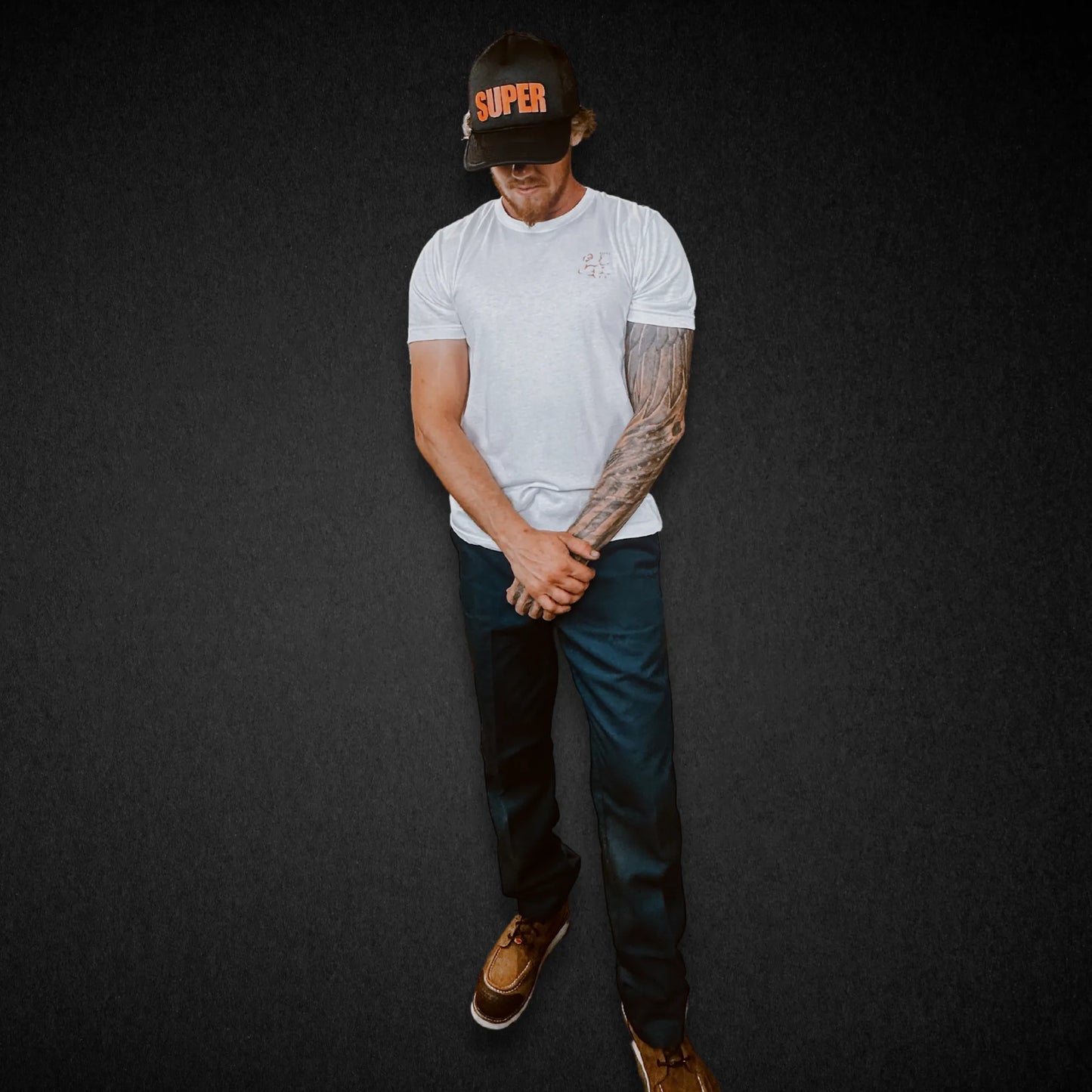 Model wearing white Super Core Tee in full body lifestyle pose