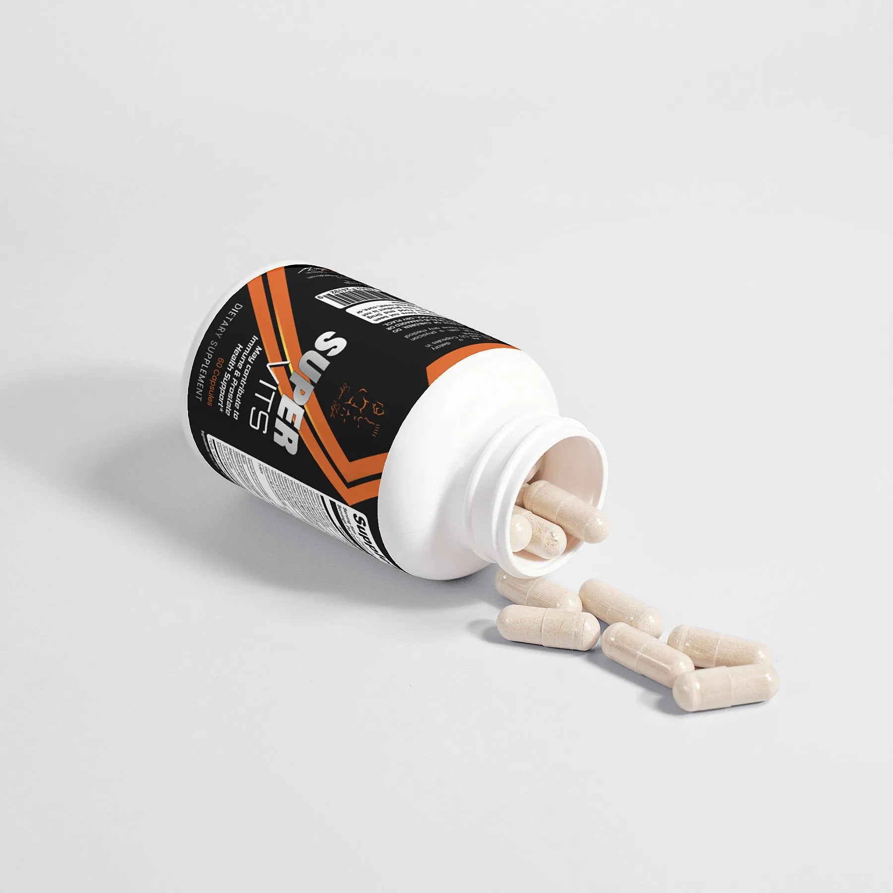 Super Style Super Vits supplement bottle tipped on its side with capsules spilling out, featuring black and orange label design emphasizing daily vitamin support and nutritional balance.