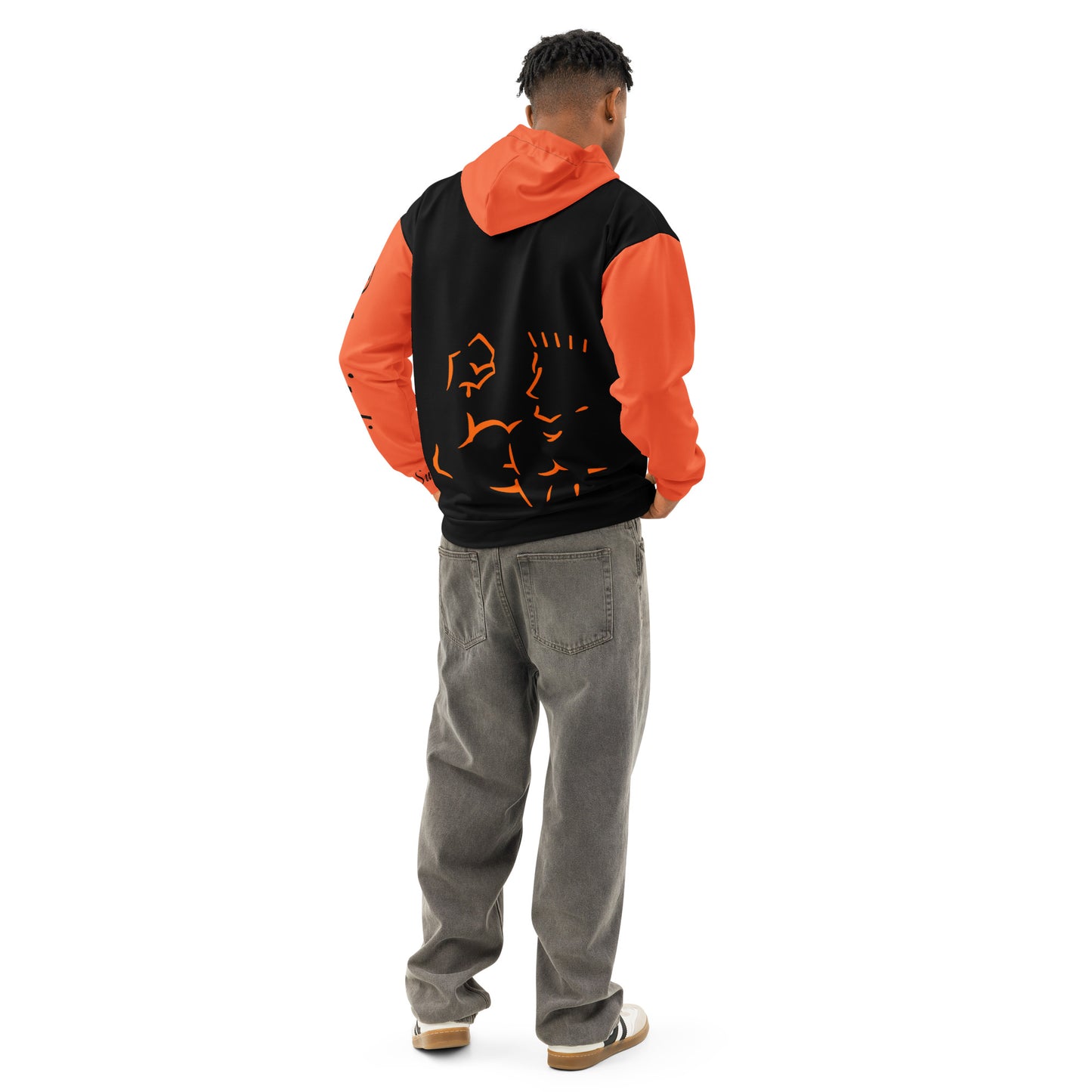 Person wearing an orange and black hoodie with a design on the back, standing against a white background