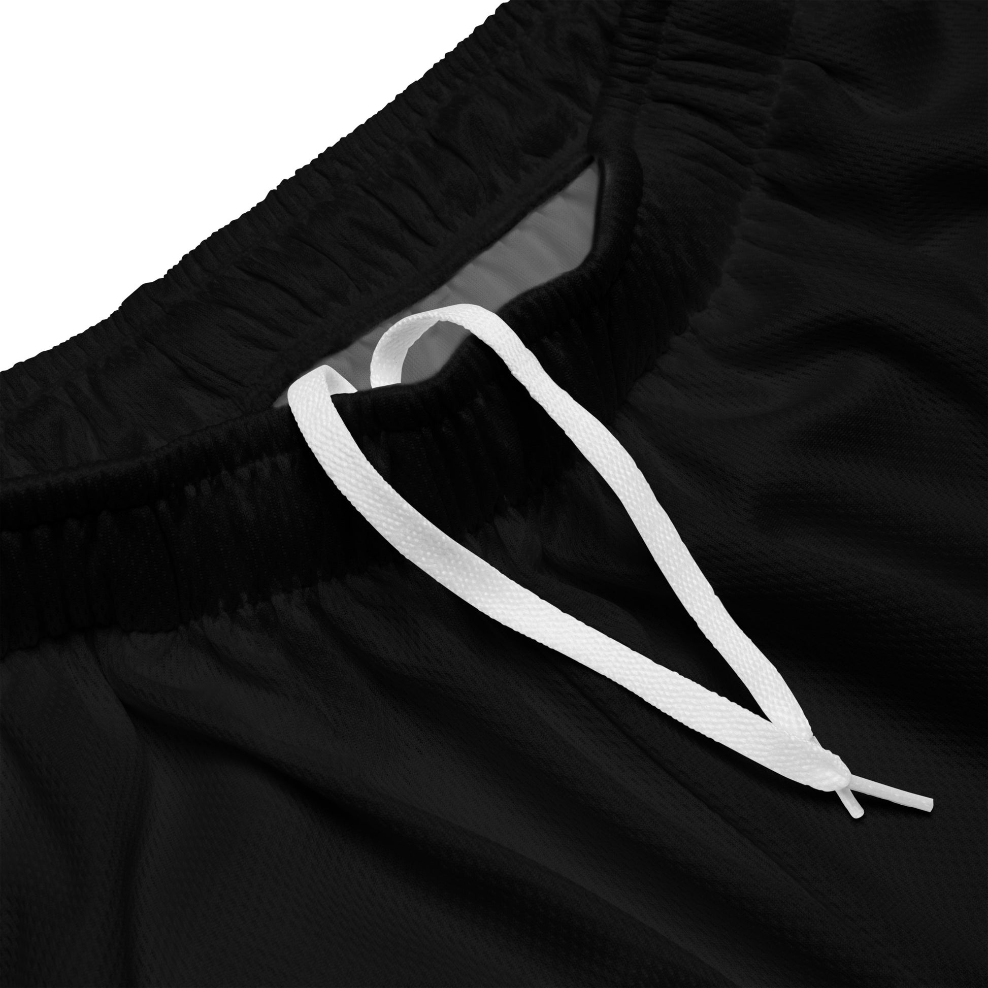 Recycled mesh shorts detail showing two-way stretch fabric texture