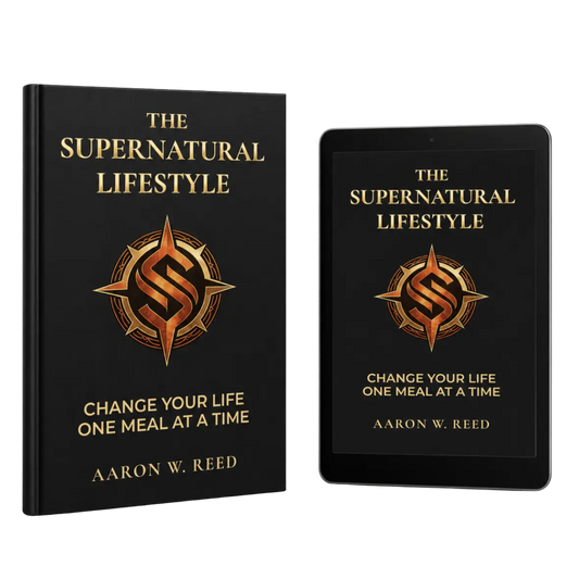 Mockup of The Supernatural Lifestyle book and digital ebook reader by Aaron W Reed featuring a black cover with a golden compass design.